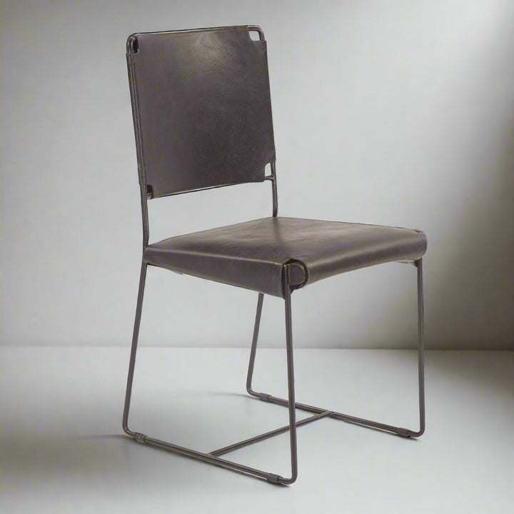 Back leather chair with metal frame on a white background