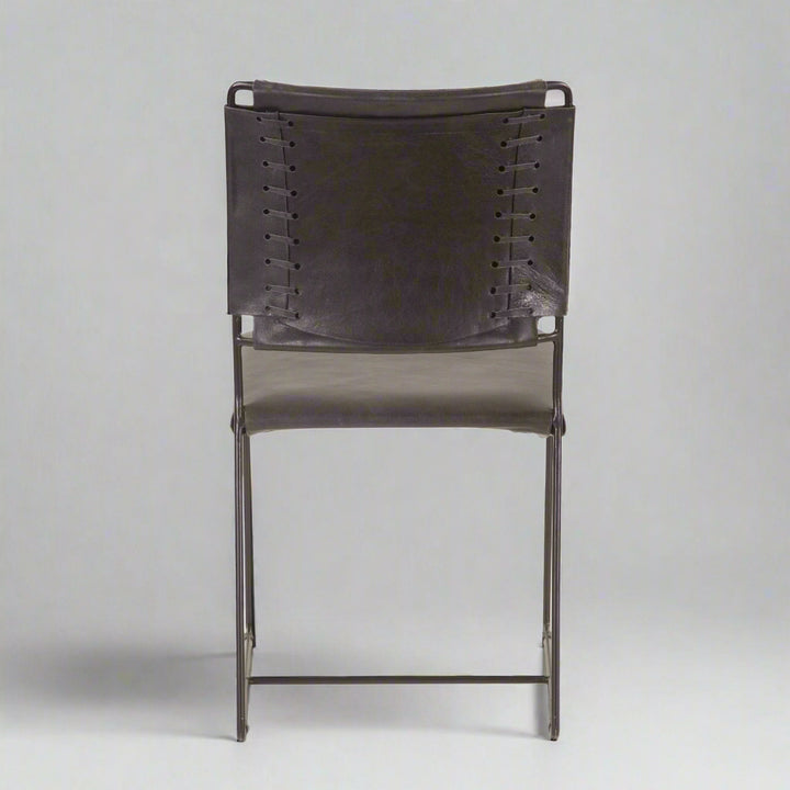 Black leather chair with metal frame on a white background