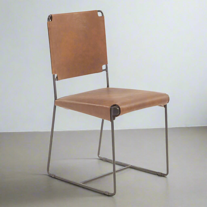 Brown leather chair with metal frame on a white background