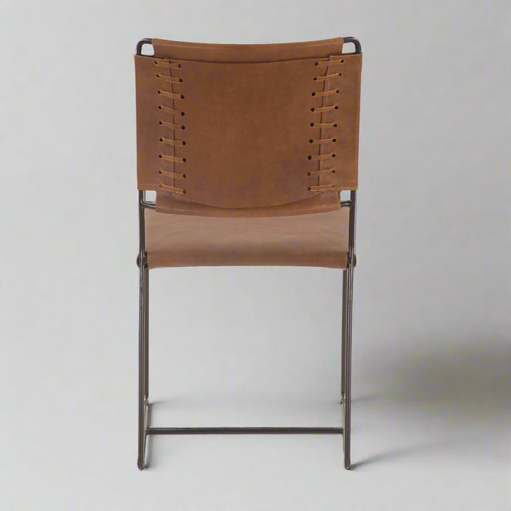 Brown leather chair with metal frame on a white background