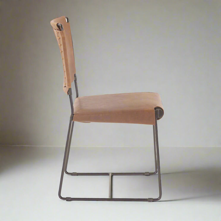 Brown leather chair with metal frame on a white background