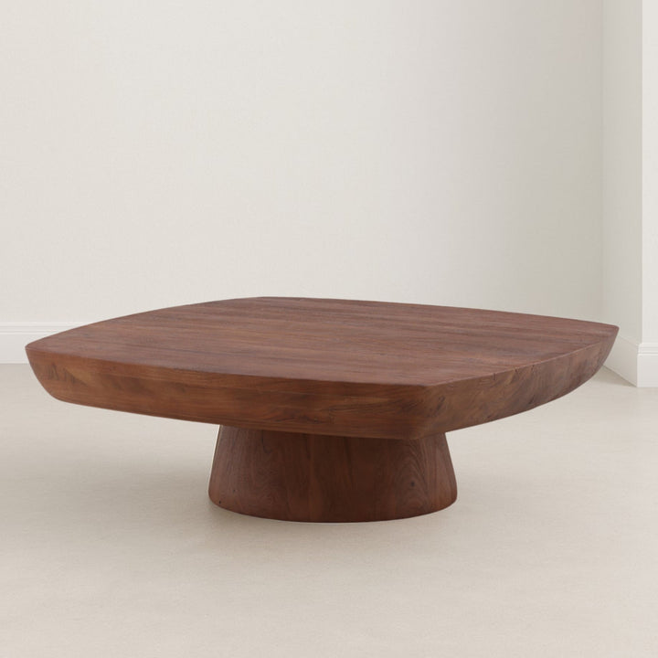 Wooden coffee table with a unique design on a plain background