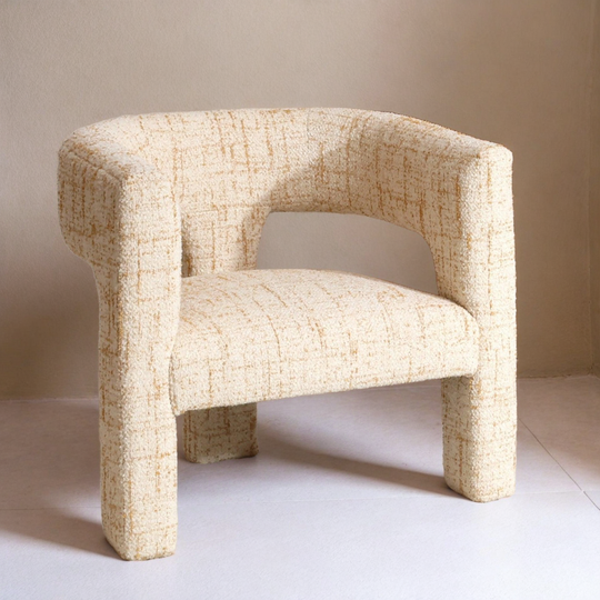 Beige textured armchair on a plain background