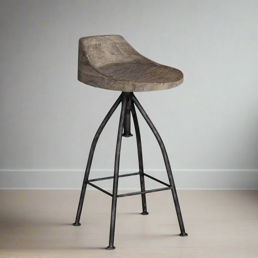 Bar stool with wooden seat and black metal legs on a white background