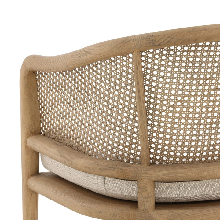 Wooden chair with woven backrest and cushion on a white background