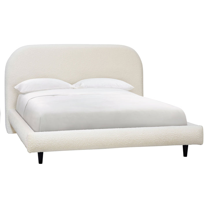 White upholstered bed with a headboard on a white background