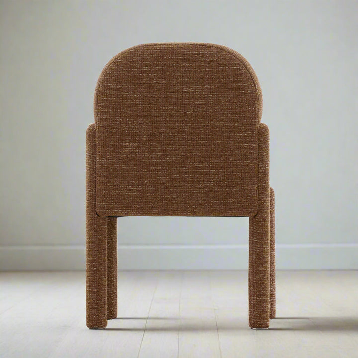 Brown upholstered chair on a white background