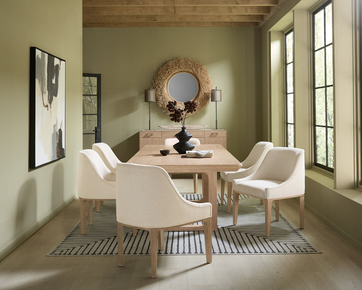 Wooden extension dining table with a natural finish, shown in a dining setting.