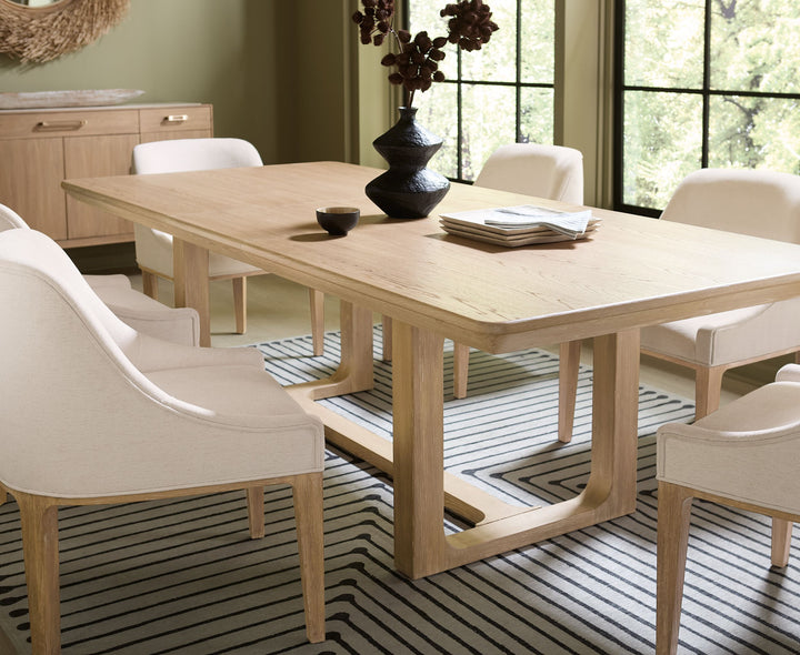 Wooden extension dining table with a natural finish, featuring a sturdy design.
