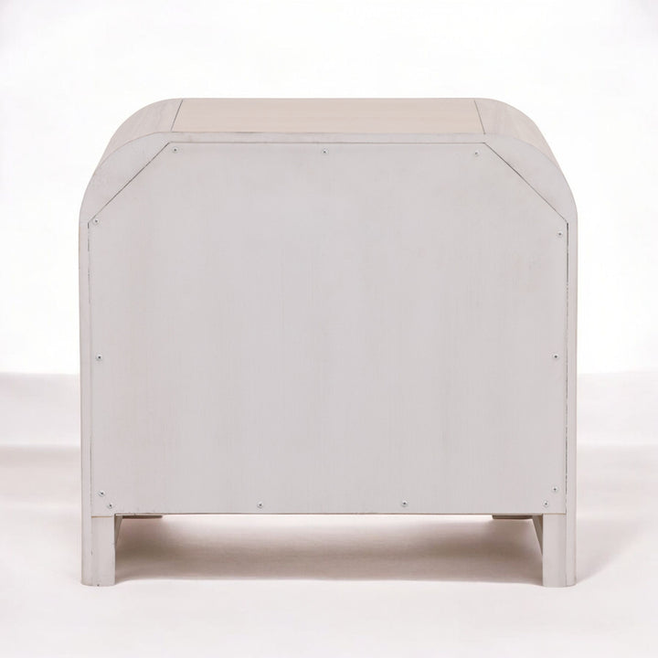 A minimalist white wooden cabinet with rounded edges, showcasing a smooth surface and simple design.