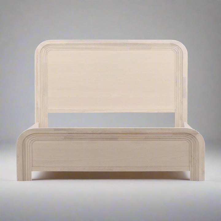 Minimalist wooden bed frame with a curved headboard and footboard, featuring a natural, unfinished look.