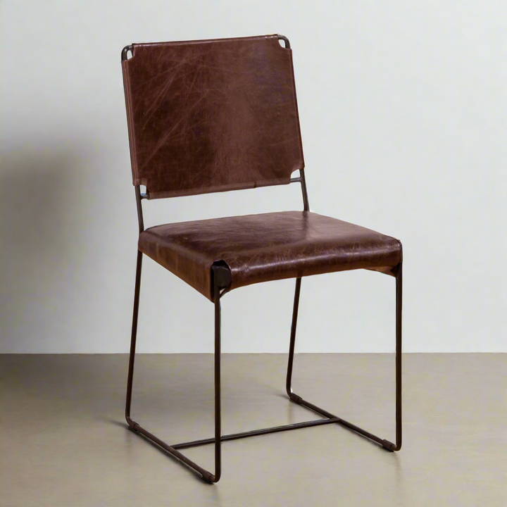 Brown leather chair with metal frame on a white background