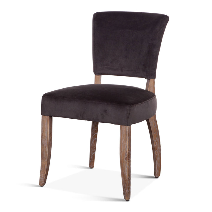 Dark brown upholstered chair with wooden legs on a white background
