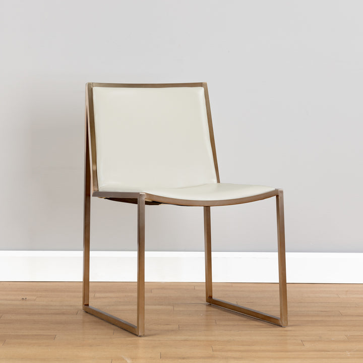 Blaird dining chair with antique brass frame and Castillo cream upholstery