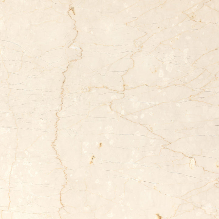 Top view of a smooth, light-colored marble table surface, showcasing delicate veins and subtle texture.