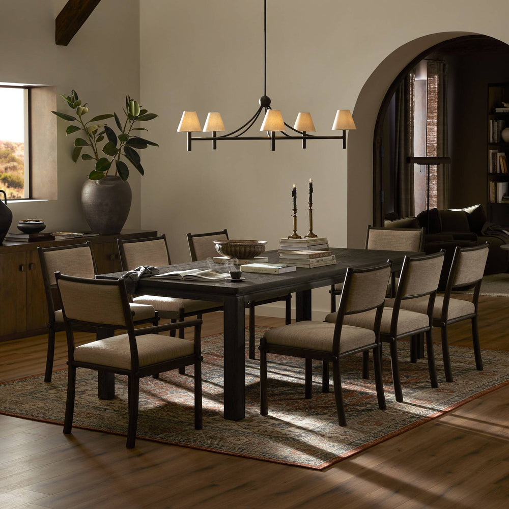 A contemporary dining table with a smooth surface and sturdy base, perfect for modern interiors.