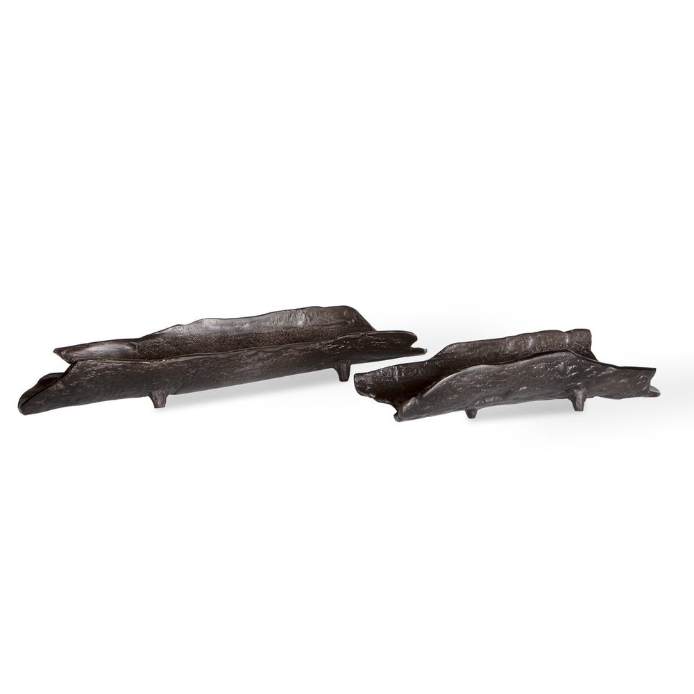 Two dark bronze decorative bowls with textured surfaces, one larger than the other, resembling organic shapes.