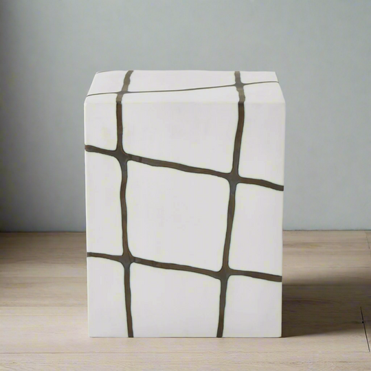 Stool with geometric pattern on a wooden floor