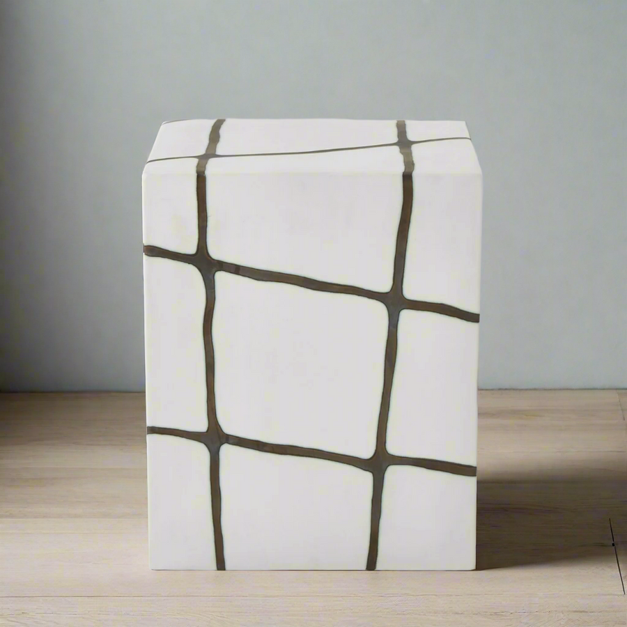 Stool with geometric pattern on a wooden floor