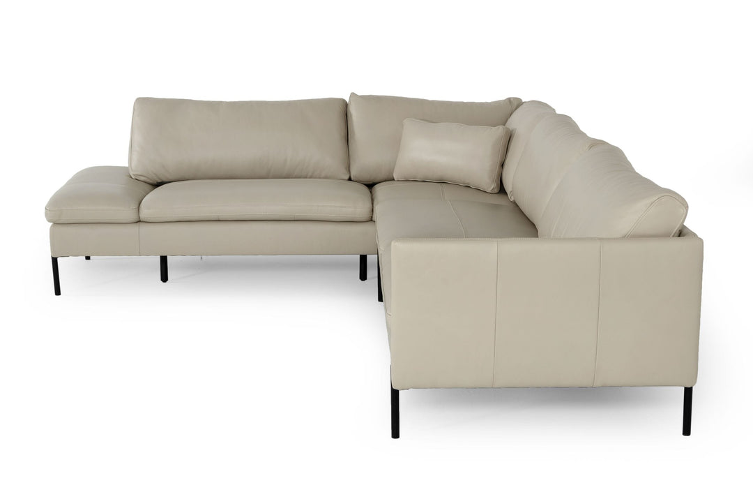 Modern beige sofa with plush cushions and a sleek, minimalist design.