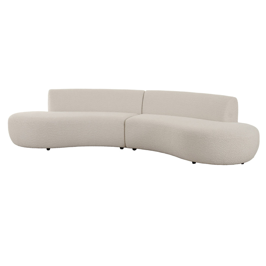Curved, contemporary beige sofa with plush textures and rounded edges.