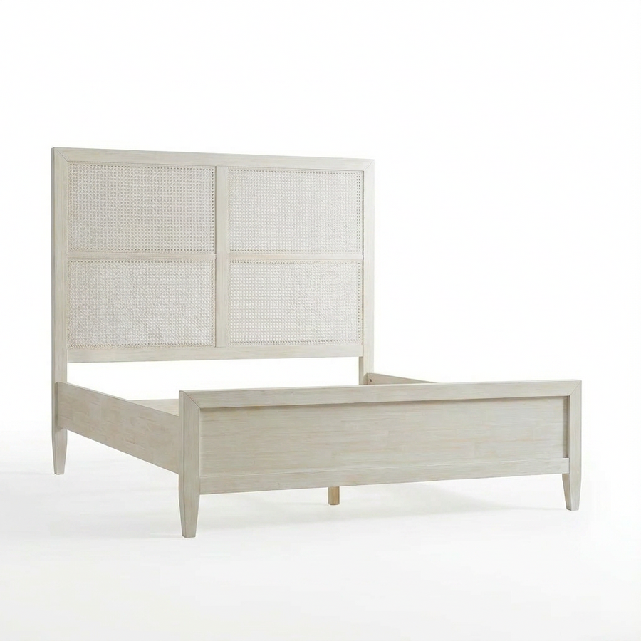 White wooden bed with wicker headboard on a white background
