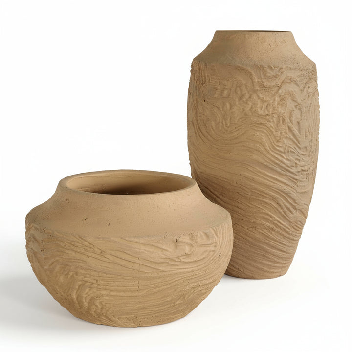 Two terracotta pots with textured surfaces on a white background