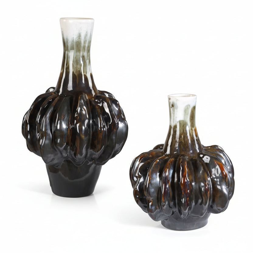 Two glass vases with a textured, bulbous design on a neutral background