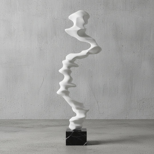 White abstract sculpture on a black base