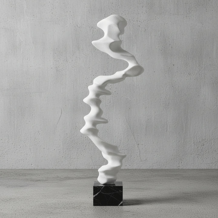 White abstract sculpture on a black base