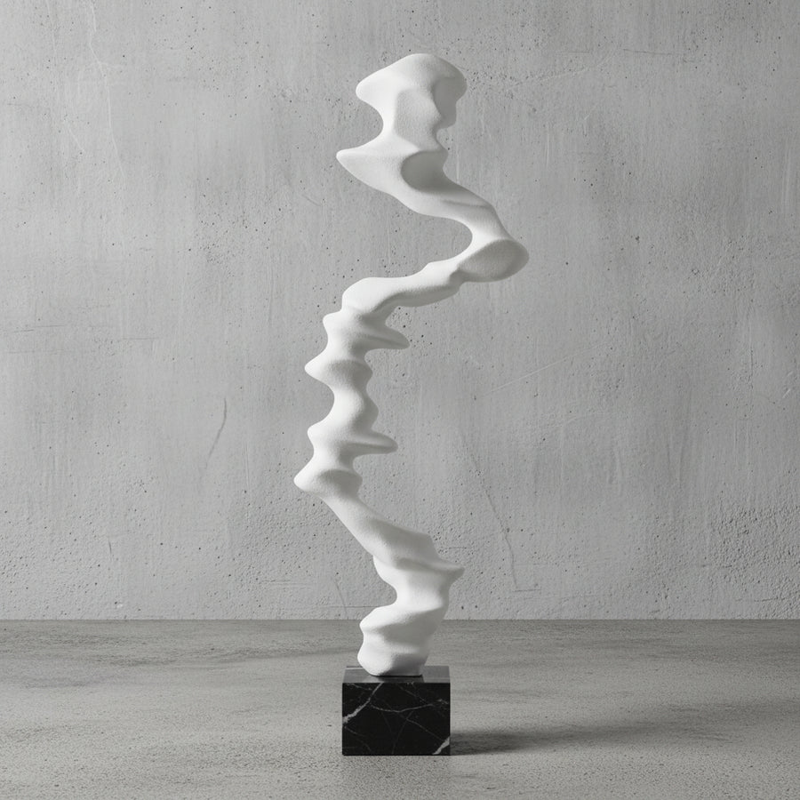 White abstract sculpture on a black base
