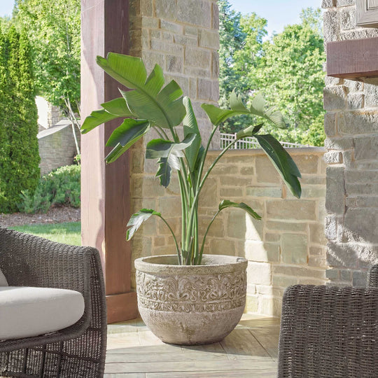 Decorative stone planter with intricate patterns