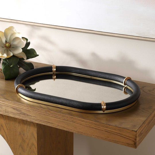 Black oval mirrored tray with gold accents