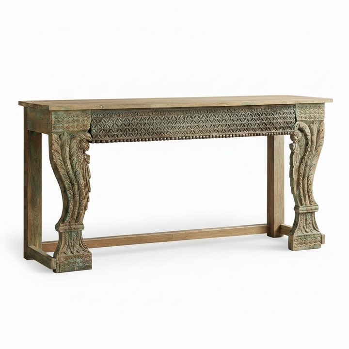 Decorative wooden console table with intricate carvings on a white background