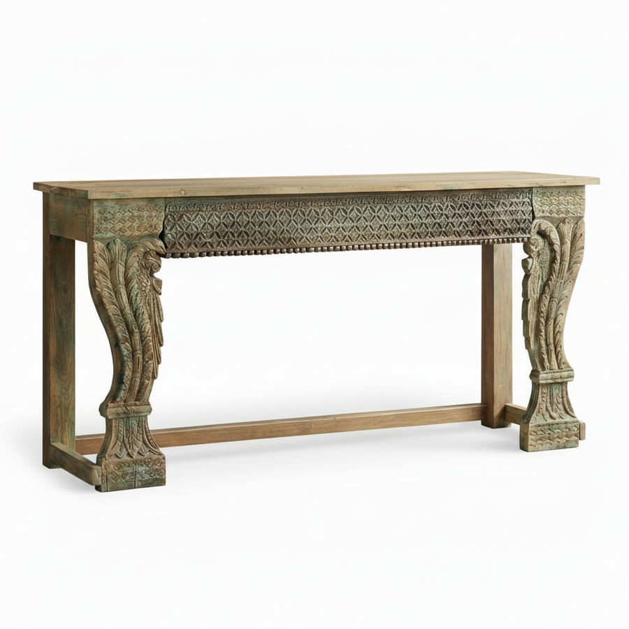 Decorative wooden console table with intricate carvings on a white background