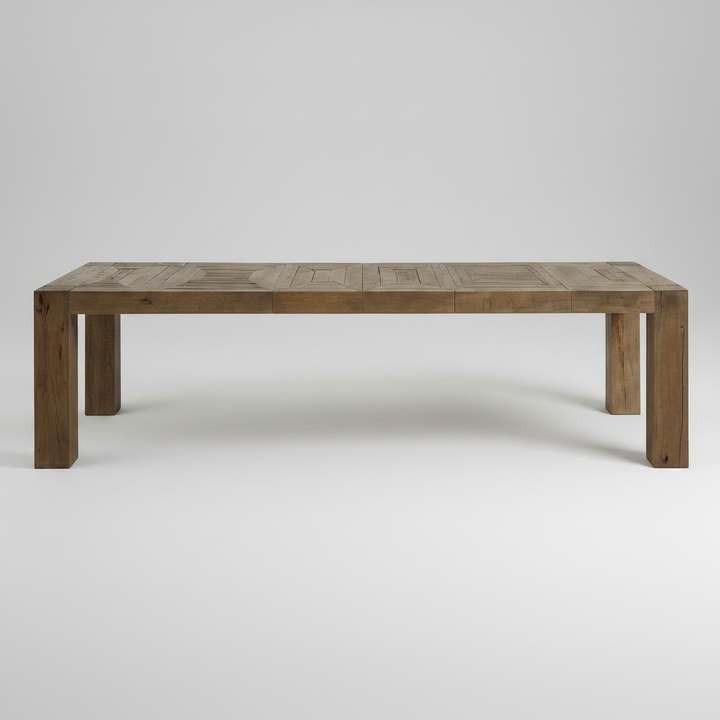 A rectangular wooden dining table with a rustic brown finish, featuring a slatted top and blocky legs, photographed against a neutral light gray background.