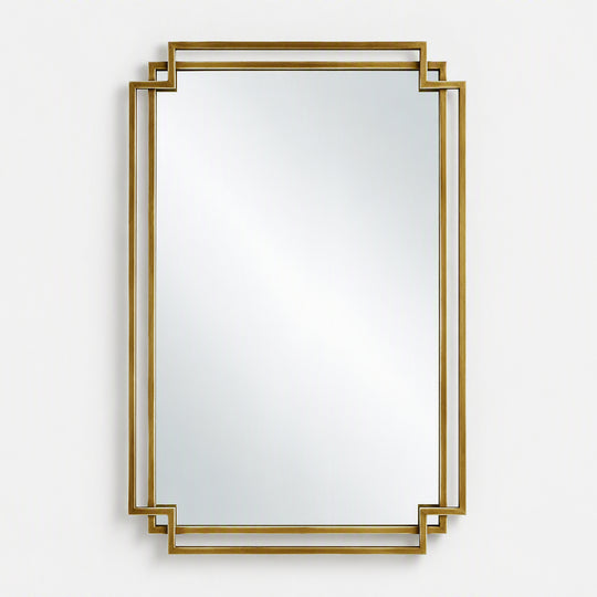 A rectangular wall mirror with a decorative gold geometric frame, shown against a plain light gray background.