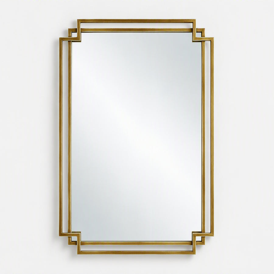 A rectangular wall mirror with a decorative gold geometric frame, shown against a plain light gray background.