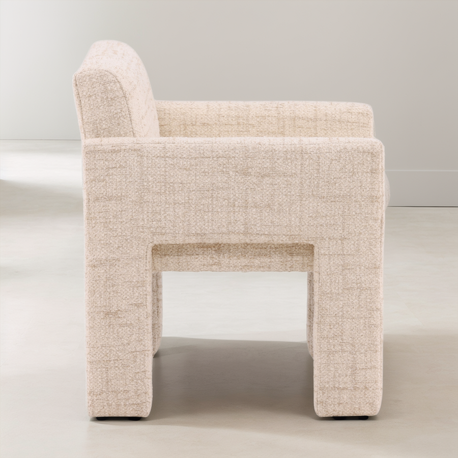 Beige armchair on a light gray background