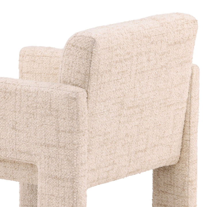 Beige upholstered chair with a textured fabric finish on a white background