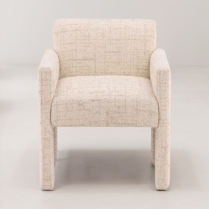 Beige armchair on a light gray background