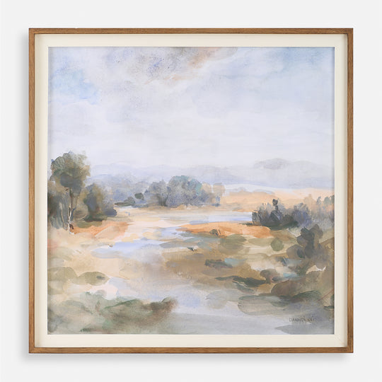 A framed print of a serene river landscape with pastel blue, olive, and rust colors, enclosed in a chestnut frame with a white linen liner.