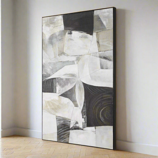 Abstract art piece with geometric shapes in black, white, and gray on a white background
