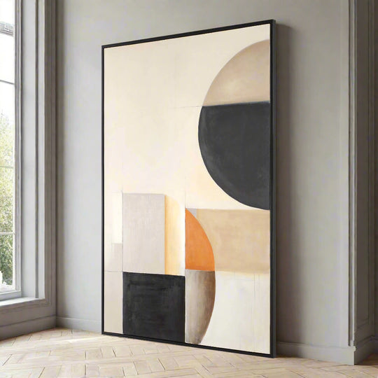 Abstract art piece with geometric shapes in a black frame on a white background