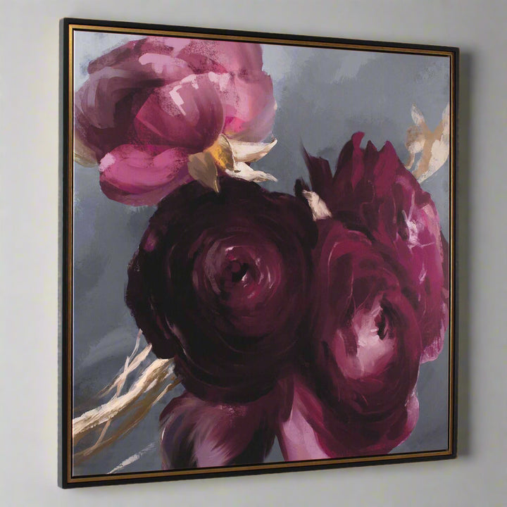 Framed artwork of pink and purple flowers on a gray background