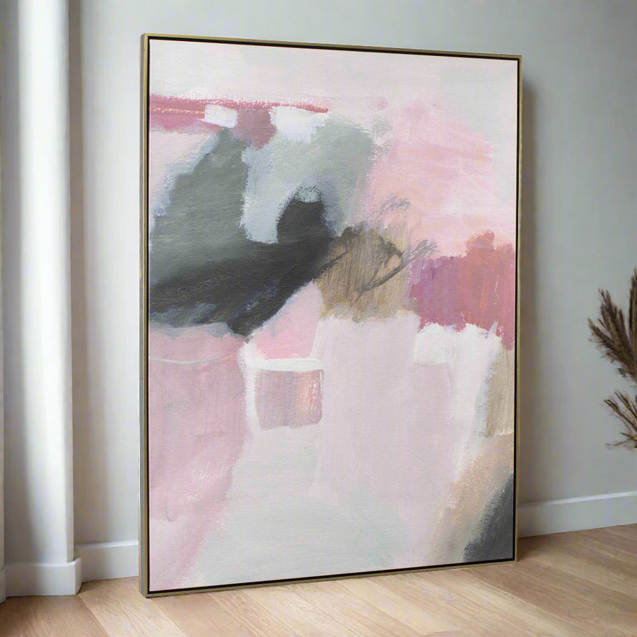 Abstract art painting with pink, black, and white colors in a gold frame on a white background