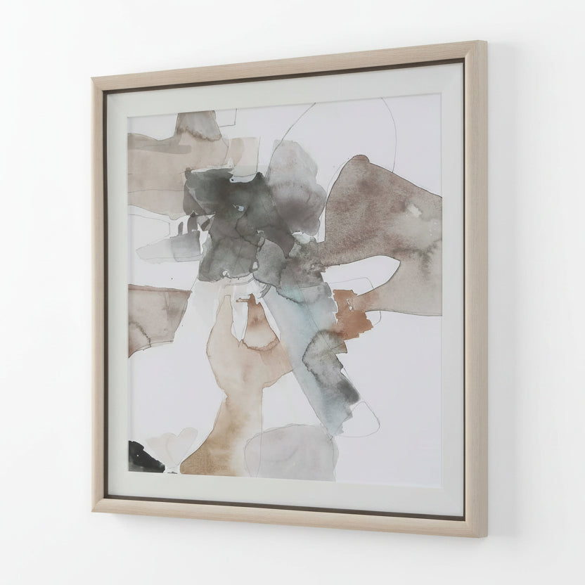 Glass framed abstract art piece with earthy tones