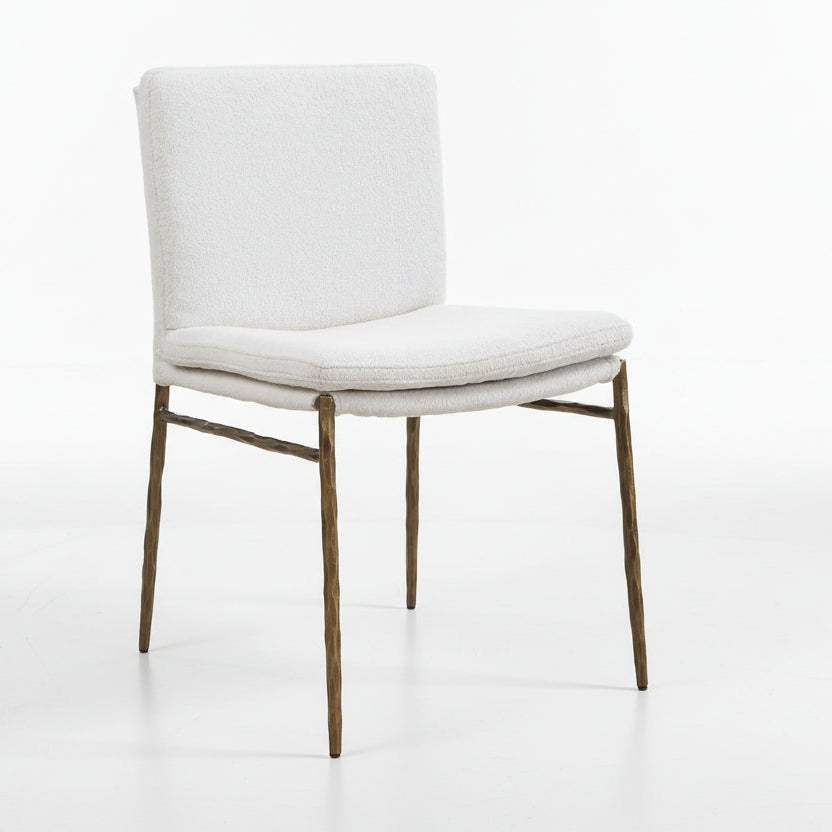 off-white upholstered chair with gold legs