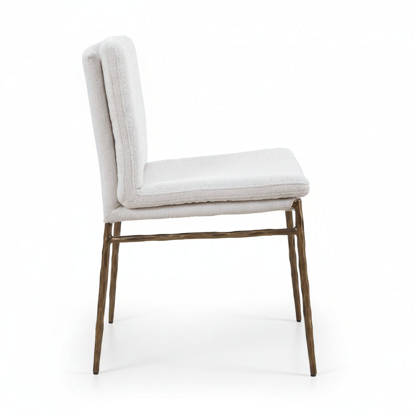 off-white upholstered chair with gold legs