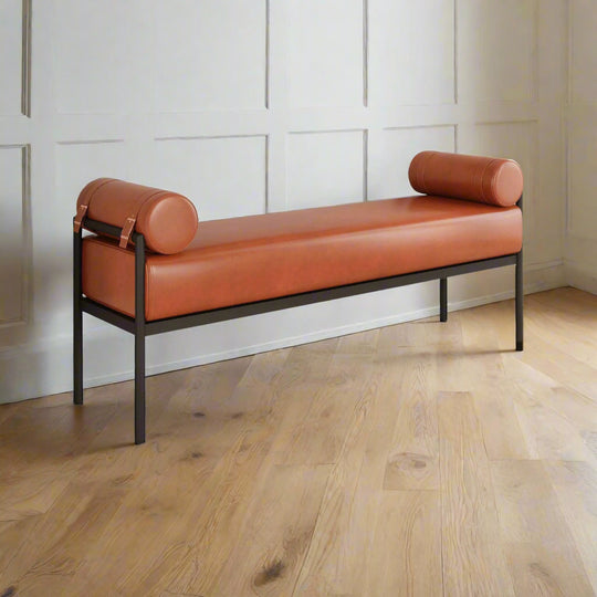 Brown leather bench with rolled ends on a white background